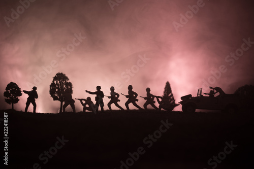 War Concept. Military silhouettes fighting scene on war fog sky background, World War German Tanks Silhouettes Below Cloudy Skyline At night. Attack scene. Armored vehicles.