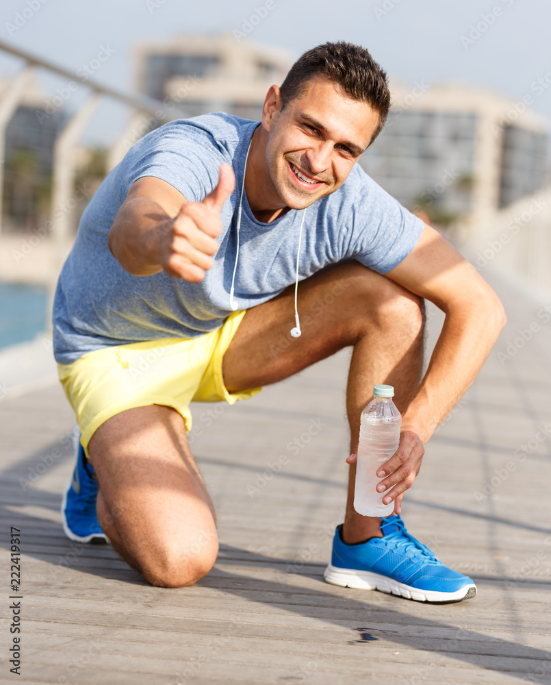 Man drinking water during workout
