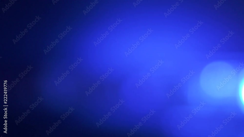 Defocused police red blue emergency lights flashing in the dark