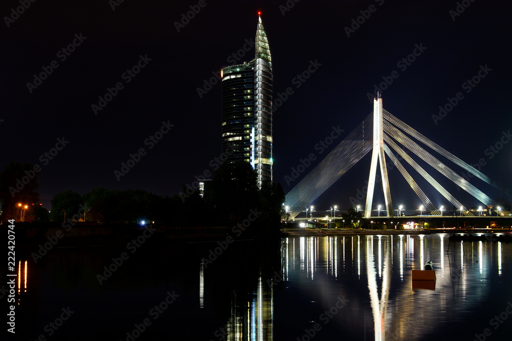 Riga Vants bridge and Riga at night view from boat pier