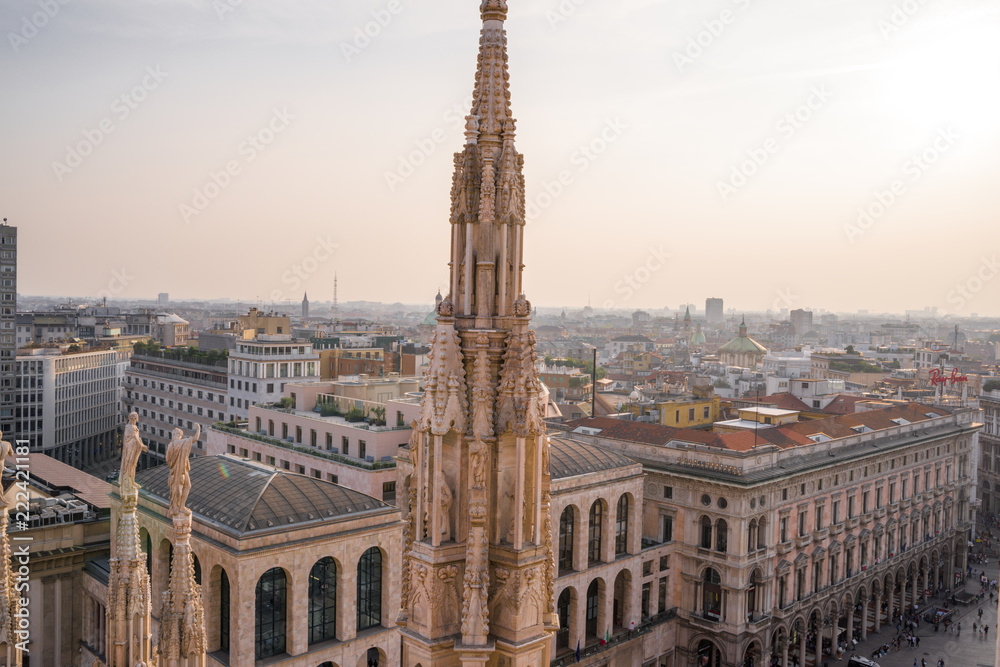 Rooftop view of spires, sculpture, cathederal, and Milan from the Duomo di Milan Rooftop view of spires, sculpture, cathederal, and Milan from the Duomo di Milan