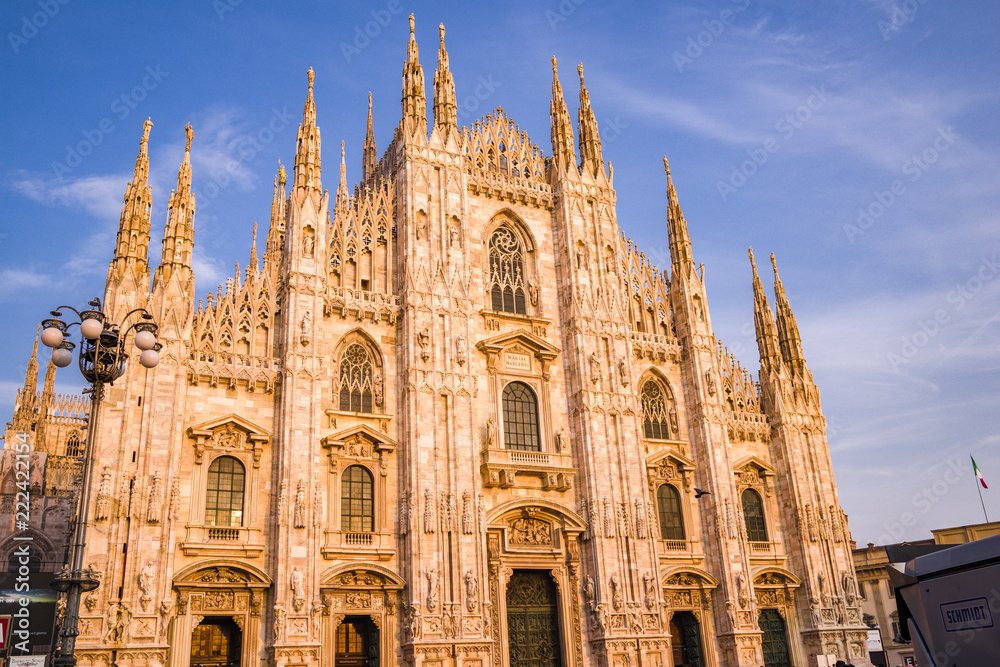 Sunset, golden hour shines on the Duomo di Milano as seen from the Piazza del Duomo, Milan, Italy