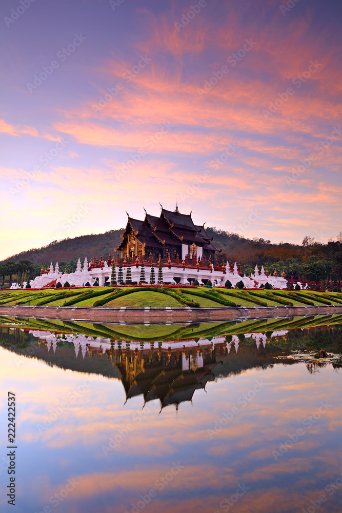 Beautiful reflection of The Royal Ratchaphruek Park and pavilion on during sunset in Chiang Mai, Thailand