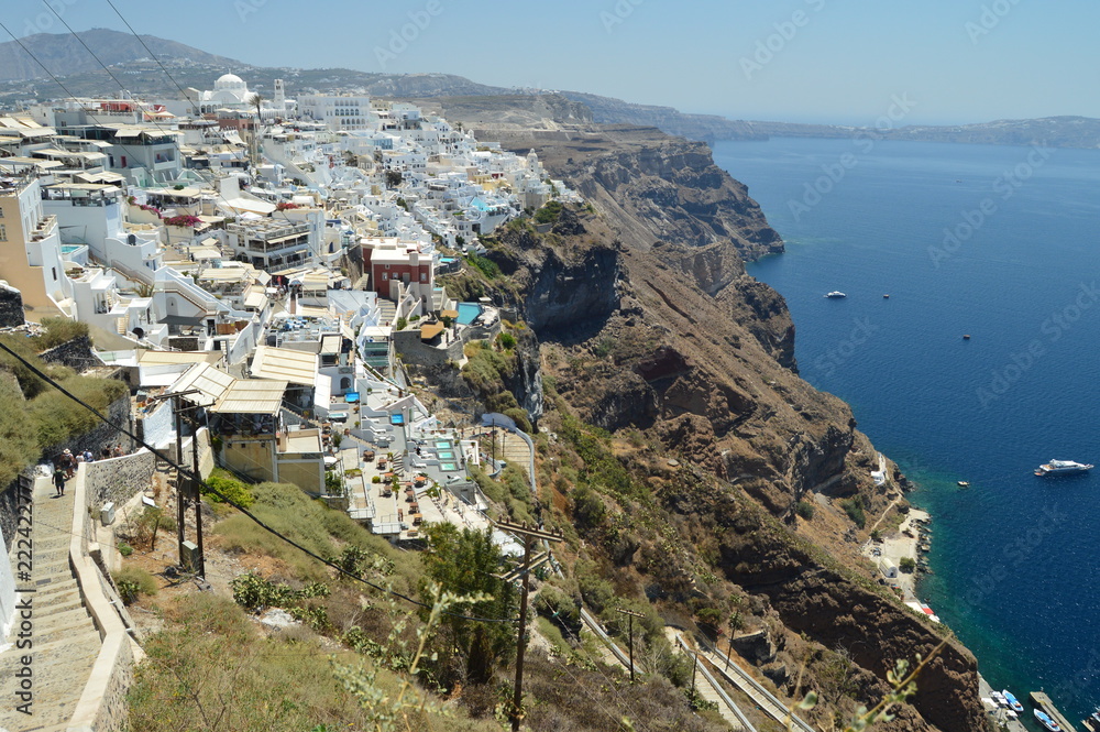 Infinite Hillside Full Of Typical White And Blue Houses In The Beautiful City Of Fira On The Island Of Santorini. Architecture, landscapes, travel, cruises. July 7, 2018. Santorini, Thera. Greece.