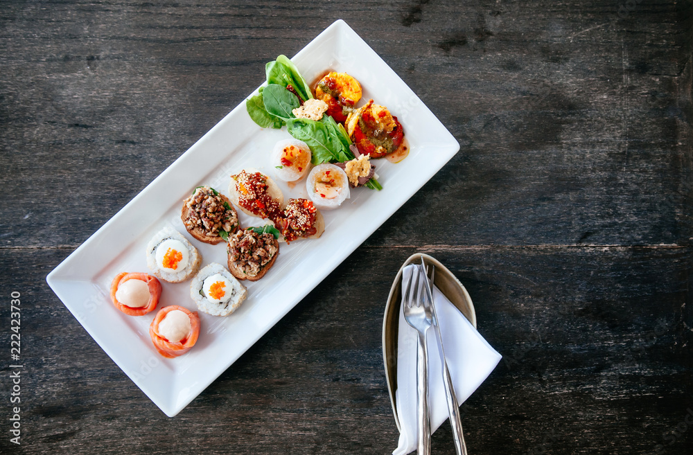 Asian canapes appetizer Smoked salmon, maki, larb, tuna tartare