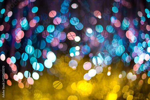 Festive Christmas elegant abstract background with Purple and Neon bokeh lights and stars photo