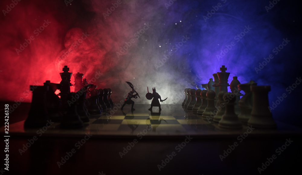 Medieval battle scene with cavalry and infantry on chessboard. Chess board game concept of business ideas and competition and strategy ideas Chess figures on a dark background Medieval battle scene with cavalry and infantry on chessboard. Chess board game concept of business ideas and competition and strategy ideas Chess figures on a dark background