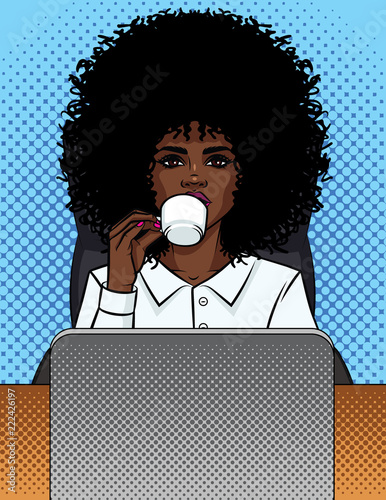 Vector illustration of a comic pop art style business woman sitting in an office and drinking coffee. African American girl secretary in an office chair behind a computer. Office worker woman