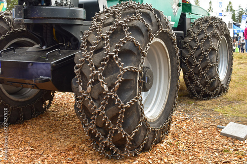 Skidder chains or traction chains are put to tires for more effective traction to the ground when heavy equipments are at work. photo