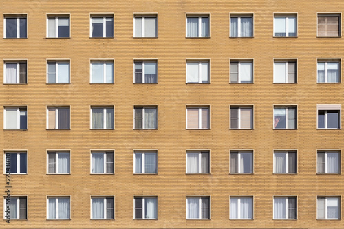 Fragment of multi-storey building with windows, texture, background, close-up