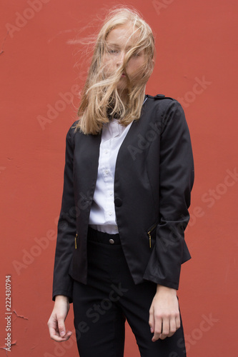 Portrait of a young smiling woman isolated on background with copy space