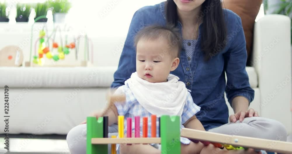 Cute little baby with mom. Mother and son playing education toy. boy and woman playing together. Cute little baby with mom. Mother and son playing education toy. boy and woman playing together.