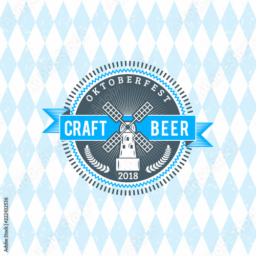 Beer festival Oktoberfest celebrations. Vintage beer badge on the traditional Bavarian linen flag background