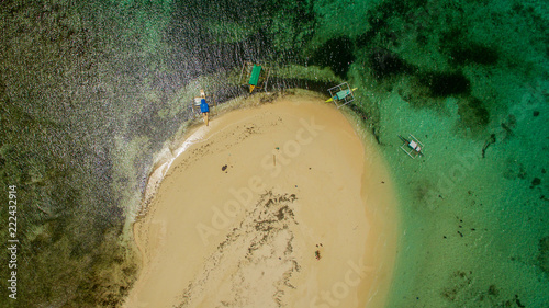 dako island vertical aerial view canoes abonded water ocean siargao philippines