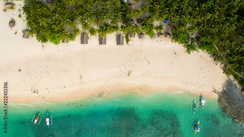 abonded island in pacific ocean palm trees aerial view drone vertical canoes in pacific ocean palm trees aerial view drone vertical canoes beach