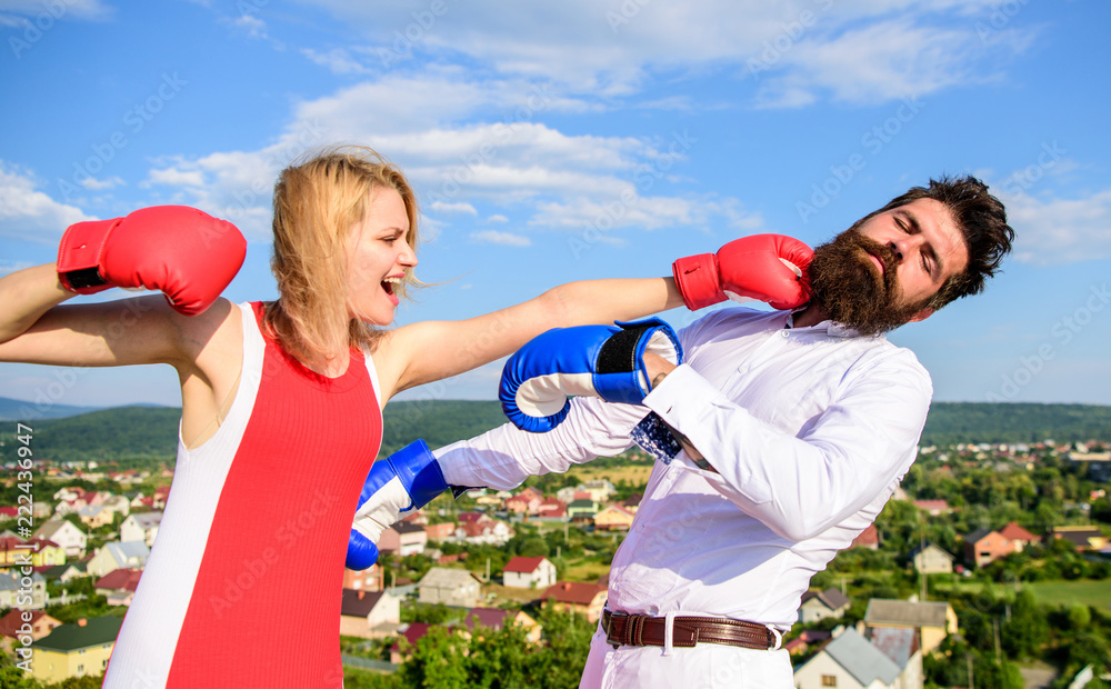 Signs you are henpecked husband. Couple boxing gloves fight sky