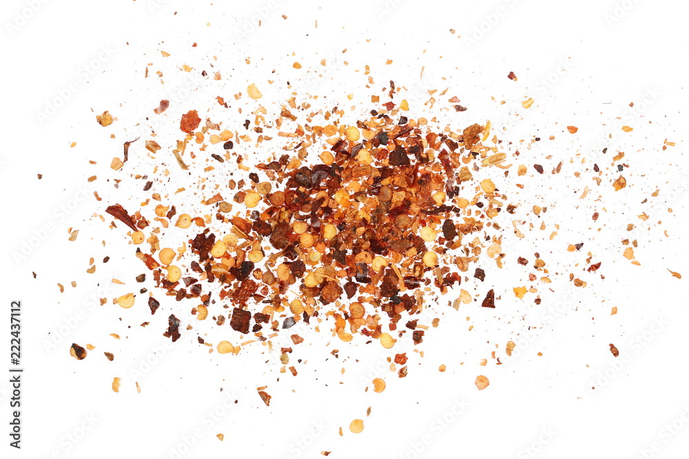 Crushed red cayenne pepper, dried chili flakes and seeds pile isolated on white background, top view