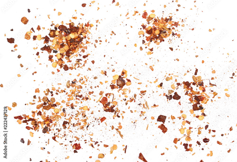 Crushed red cayenne pepper, dried chili flakes and seeds pile isolated on white background, top view Crushed red cayenne pepper, dried chili flakes and seeds pile isolated on white background, top view