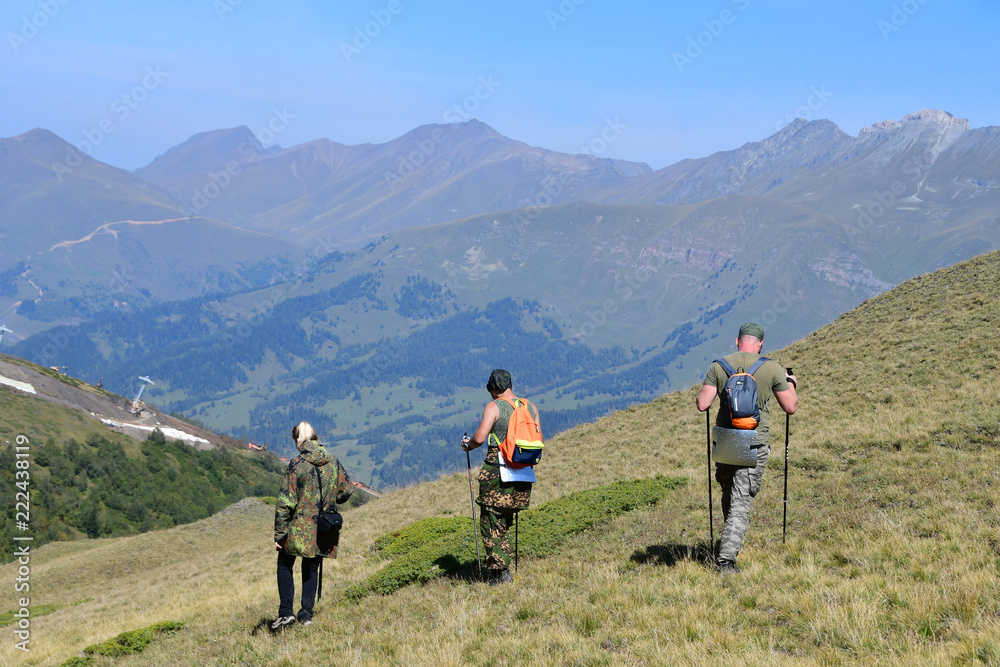  Russia, Caucasus, Arkhyz. Tourists on the plateau Gabulu in sunny weather