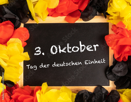 German Text 3. Oktober Tag der deutschen Einheit, in english, 3. October, day of german unity with national colors photo