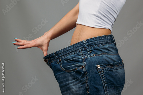 Woman trying jeans photo