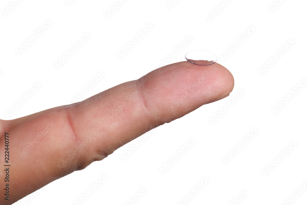 close up on a finger holding a contact lens isolated on white background with clipping path close up on a finger holding a contact lens isolated on white background with clipping path