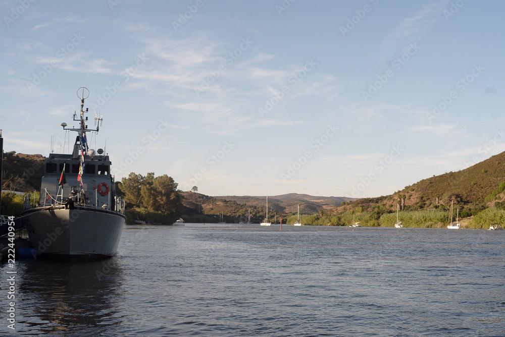 Fototapeta premium motor boats and sailing ship moored in the river
