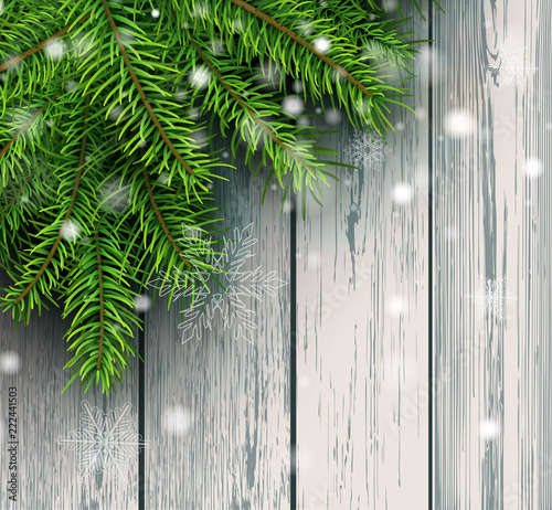 Christmas background, green fir tree decoration on old wooden board with snowflakes