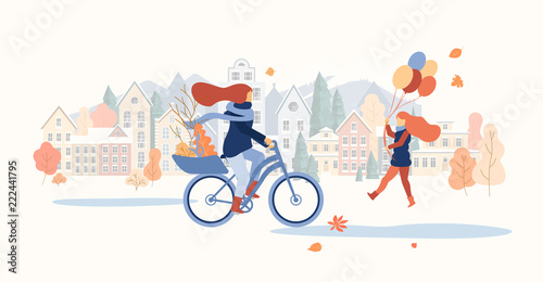 Autumn cityscape. Girls spend leisure time outdoors in park.