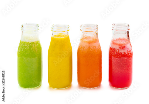 Colourful smoothie juice bottles isolated on white background