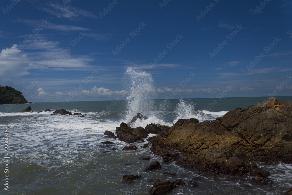 waves crashing on the rocks Sea waves hit beach rocks. Never stop all the time