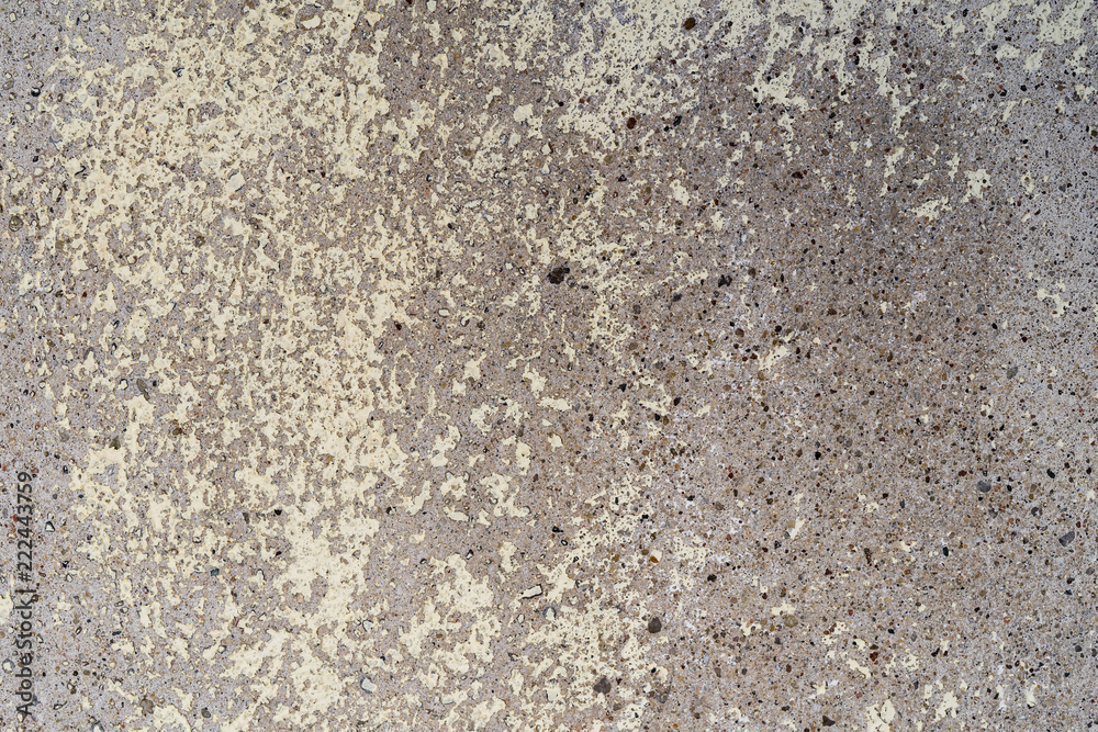 Old weathered concrete wall with flaky paint as a background. Old weathered concrete wall with flaky paint as a background.