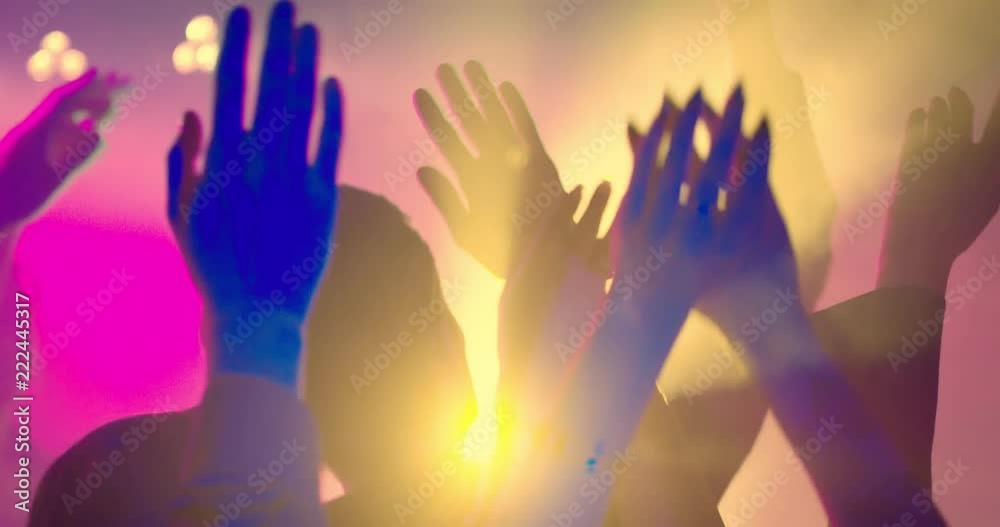 Hands at a Party in Slow Motion. Put your hands in the air! Friends having fun at a party or concert, a festival. They hold hands above their heads, cheering the performer. Slow motion shot Hands at a Party in Slow Motion. Put your hands in the air! Friends having fun at a party or concert, a festival. They hold hands above their heads, cheering the performer. Slow motion shot