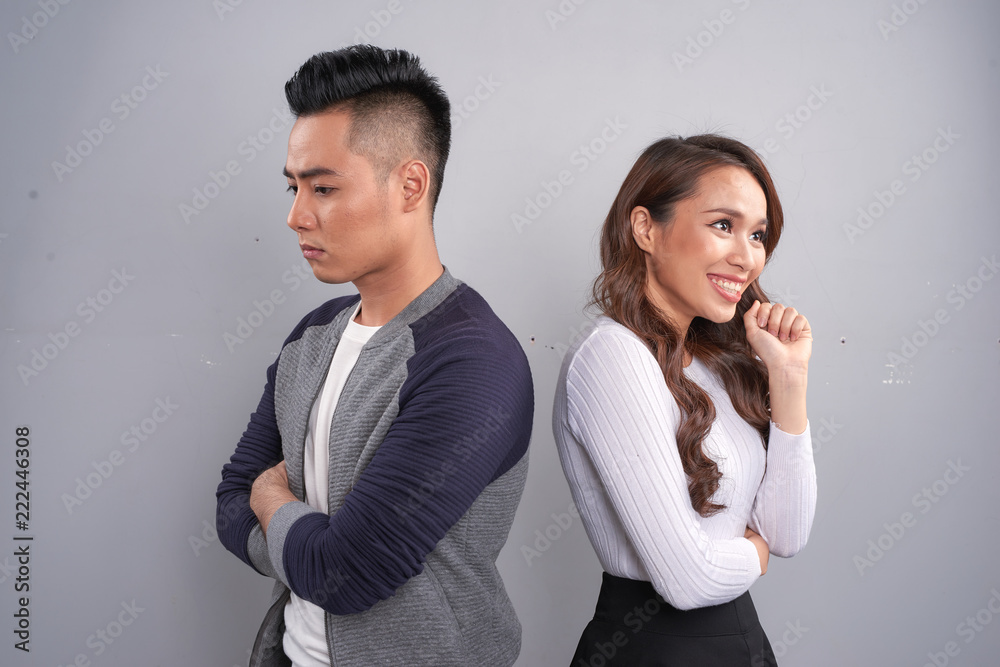 Portrait of unhappy frustrated couple standing back to back not ...