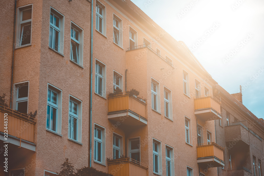 beautiful apartment building with lens flare on the top