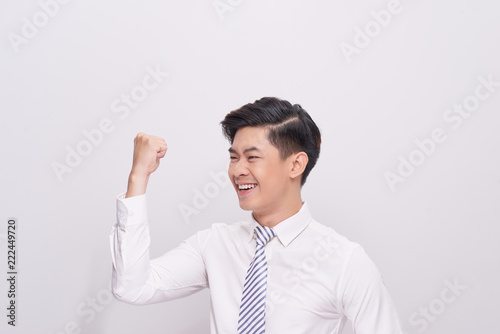 Portrait of happy excited young asian businessman