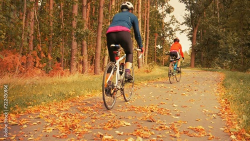 Couple riding on bike by the road