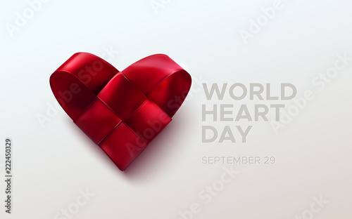 Realistic satin ribbon woven heart with World Heart Day text label. Vector health care illustration. Medical awareness day concept