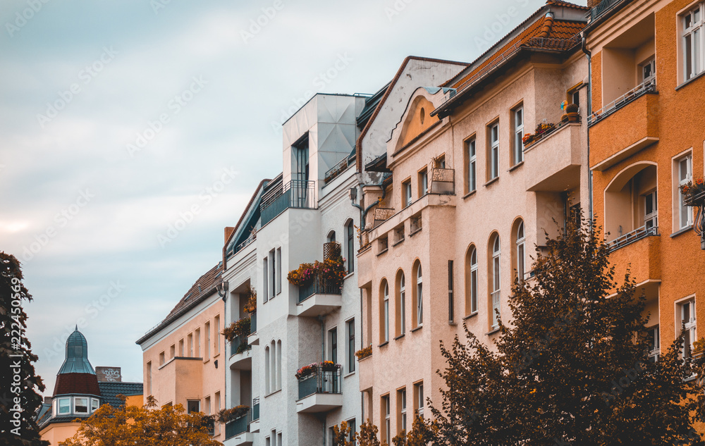 some colorful houses at berlin on a cloudy day