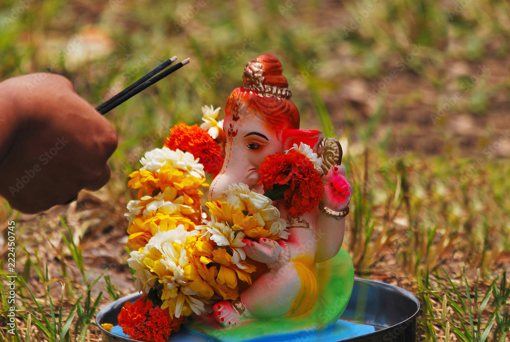 Ganesha puja before its immersion inside water Pune, India.