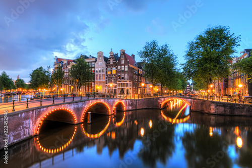 Photography Beautiful cityscape of the famous canals of Amsterdam, the Netherlands, at night