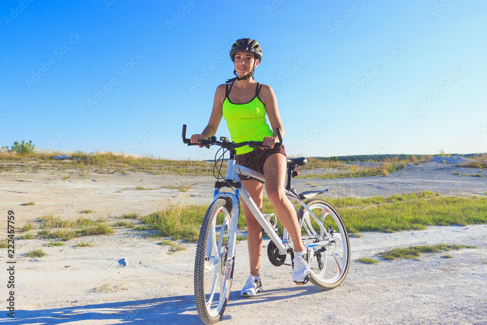 Young beautiful woman with a sport bike, soft focus background Young beautiful woman with a sport bike, soft focus background