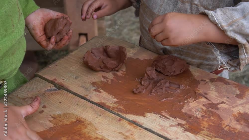 A boy and a girl are molded from clay. Ceramic Pottery Lessons A boy and a girl are molded from clay. Ceramic Pottery Lessons
