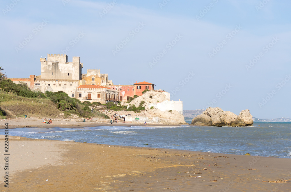 The beautiful castle of Falconara in Sicily seen from the sand beach. It was a sunny summer day in this nice hidden spot located near Butera, Caltanissetta.