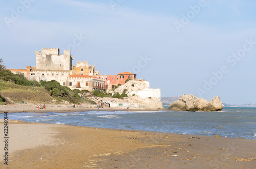 The beautiful castle of Falconara in Sicily seen from the sand beach. It was a sunny summer day in this nice hidden spot located near Butera, Caltanissetta.