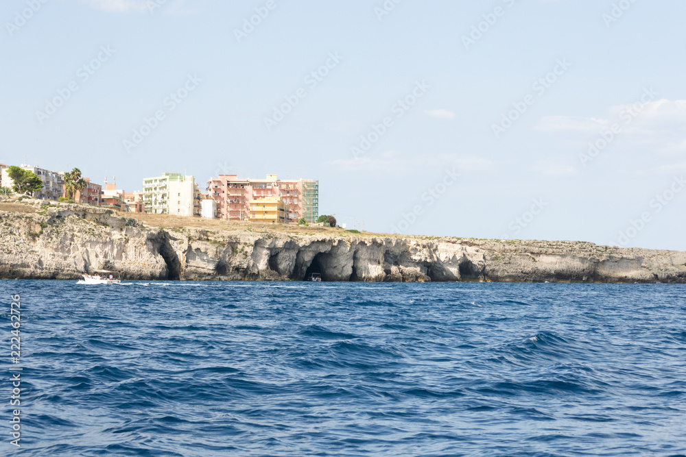 The seafront of the city of Syracuse, Sicily(Italy). In this shot taken from a boat you can see the rocky cliff on which was built the town