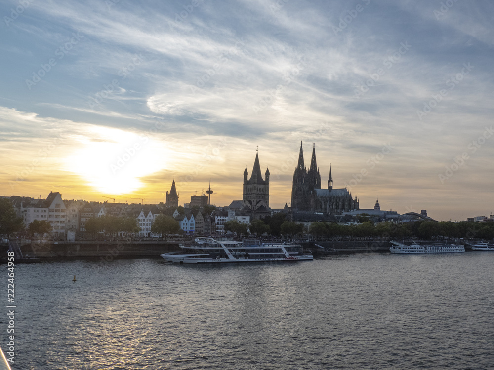 City of Colonge with view overr the river Rhine to the Kathedral and old town at sunset