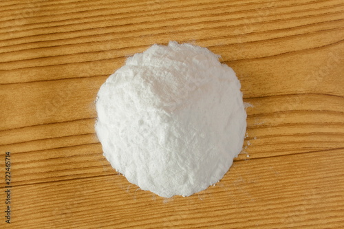 baking soda or baking powder in wooden background for cooking recipe or cleaning