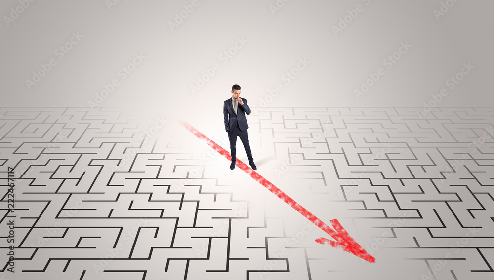 Businessman going through the maze with red arrow
Businessman going through the maze with red arrow