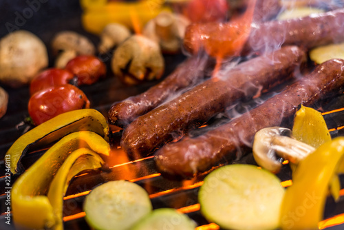 sausages and vegetables on the grill